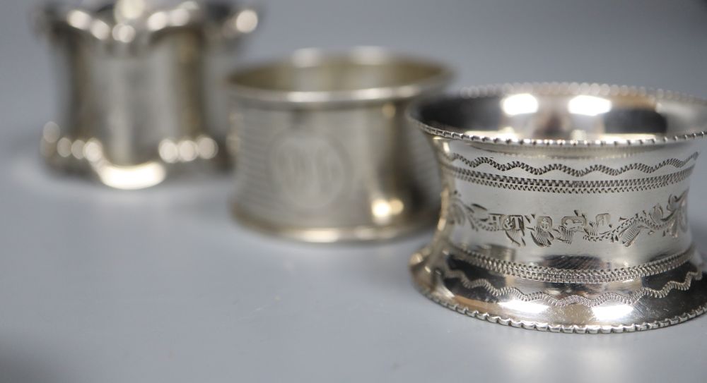 Six assorted silver napkin rings.